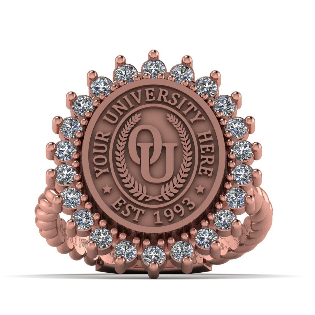 Rose gold ring with gemstones and a university emblem on a white background