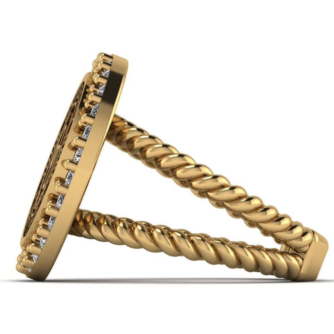 Gold ring with diamond accents on a white background