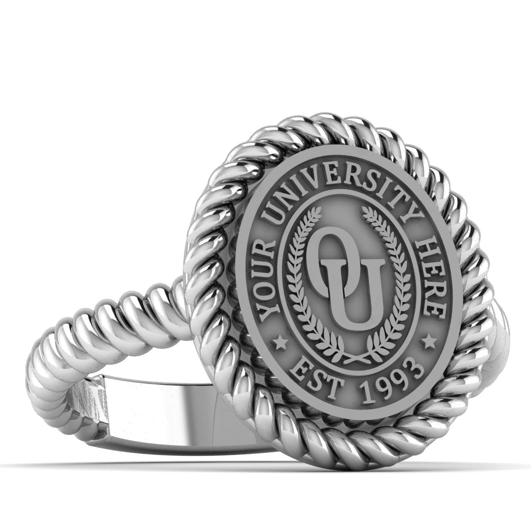 Silver ring with a university emblem on a white background