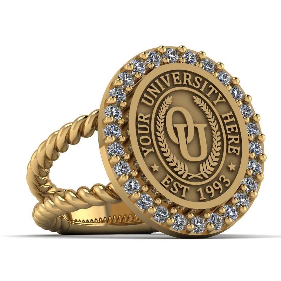 Gold ring with engraved text and gemstones on a white background